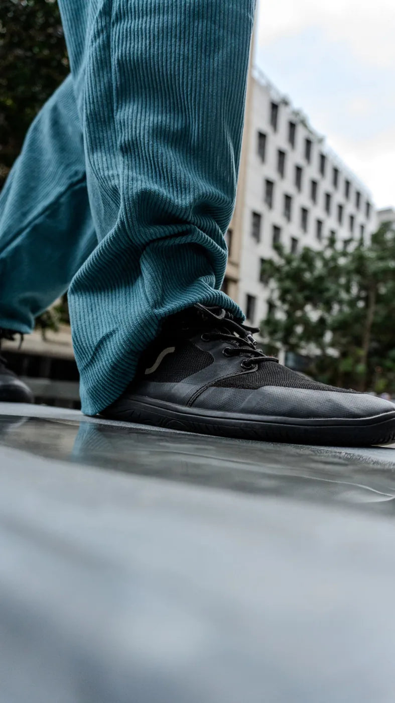 Sapmok black vellies worn on a city street